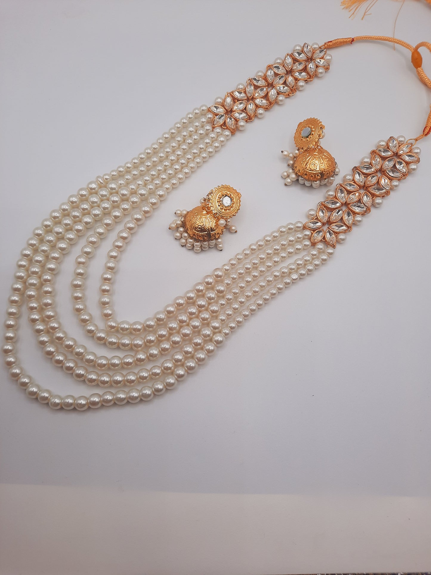 Flower shape gold plated kundan jewelry set with long maala and jhumkas - NATASHAHS