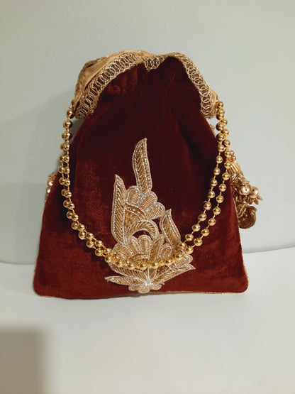 Red clutch for weddings and parties with golden chain