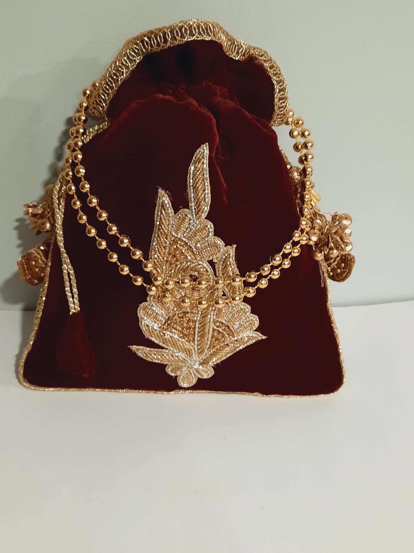 Red clutch for weddings and parties with golden chain