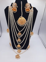 Bridal style kundan long mala with kundan jhumka and kundan teeka