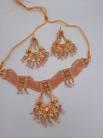 Pink guluband choker with earrings and teeka