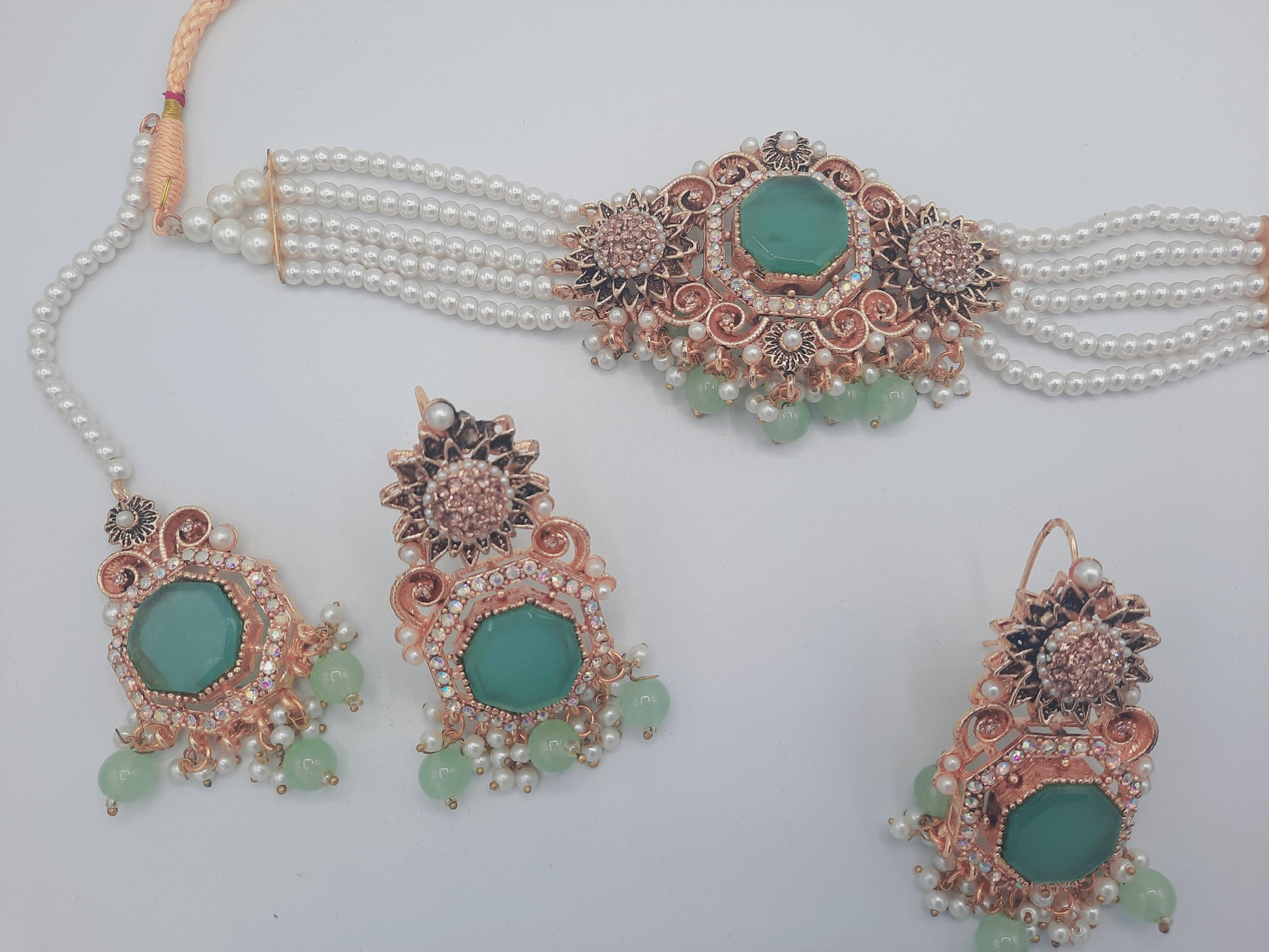Anarkali Zircon choker set with guluband earrings and teeka in green color - NATASHAHS