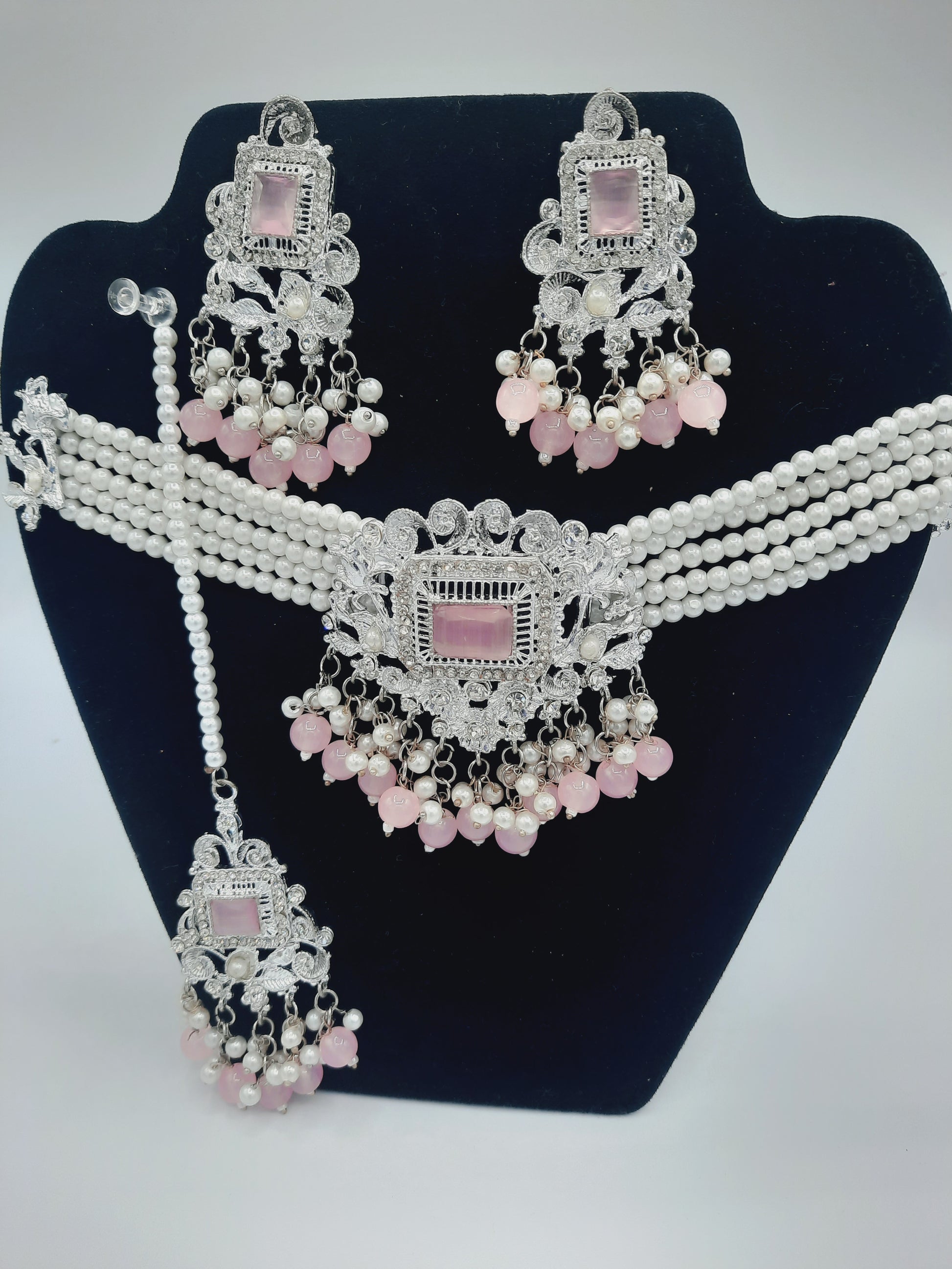 Anarkali Zircon choker set with guluband earrings and teeka in pink color in silver tone - NATASHAHS