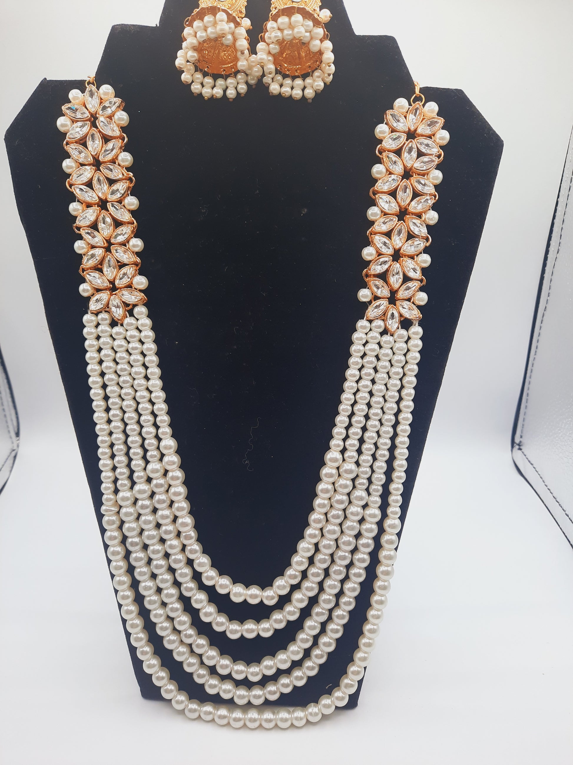 Flower shape gold plated kundan jewelry set with long maala and jhumkas - NATASHAHS