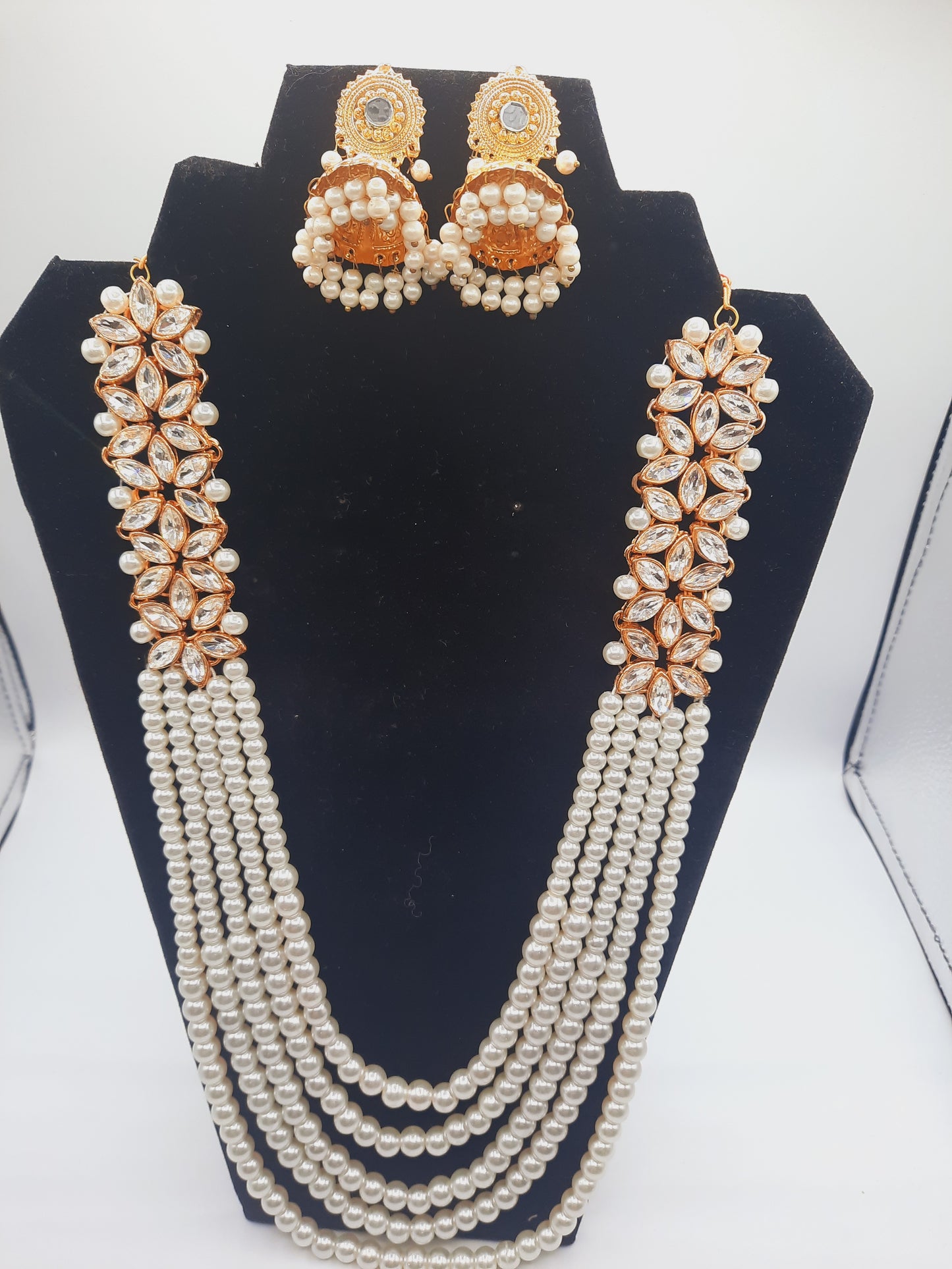 Flower shape gold plated kundan jewelry set with long maala and jhumkas - NATASHAHS