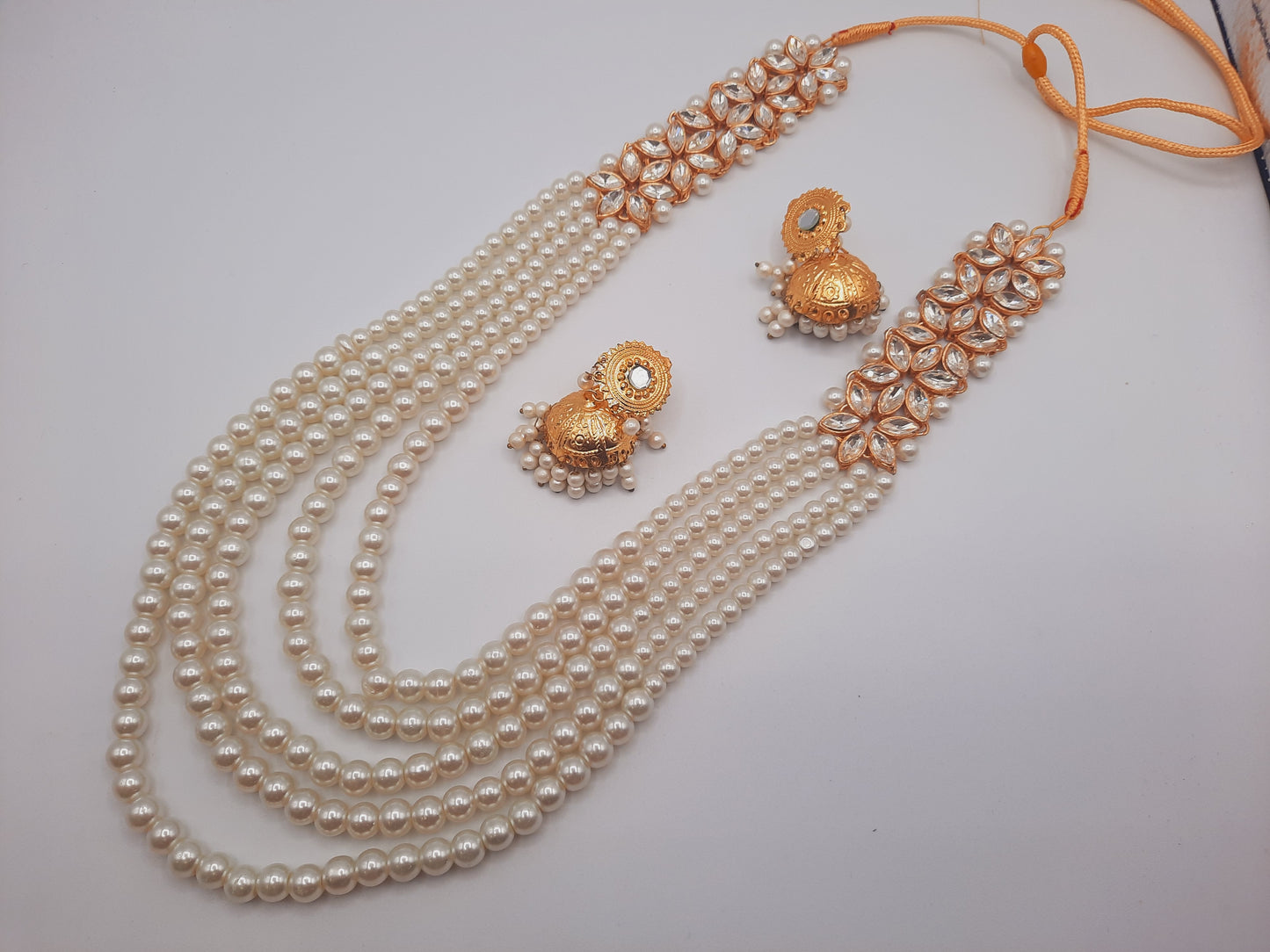 Flower shape gold plated kundan jewelry set with long maala and jhumkas - NATASHAHS