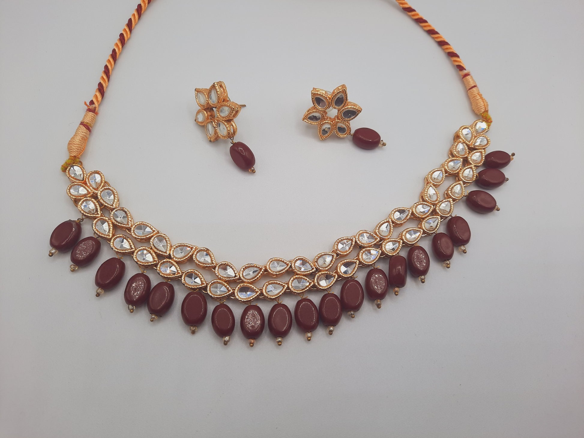 Flower shape gold plated kundan adjustable necklace with earrings in red and green color - NATASHAHS