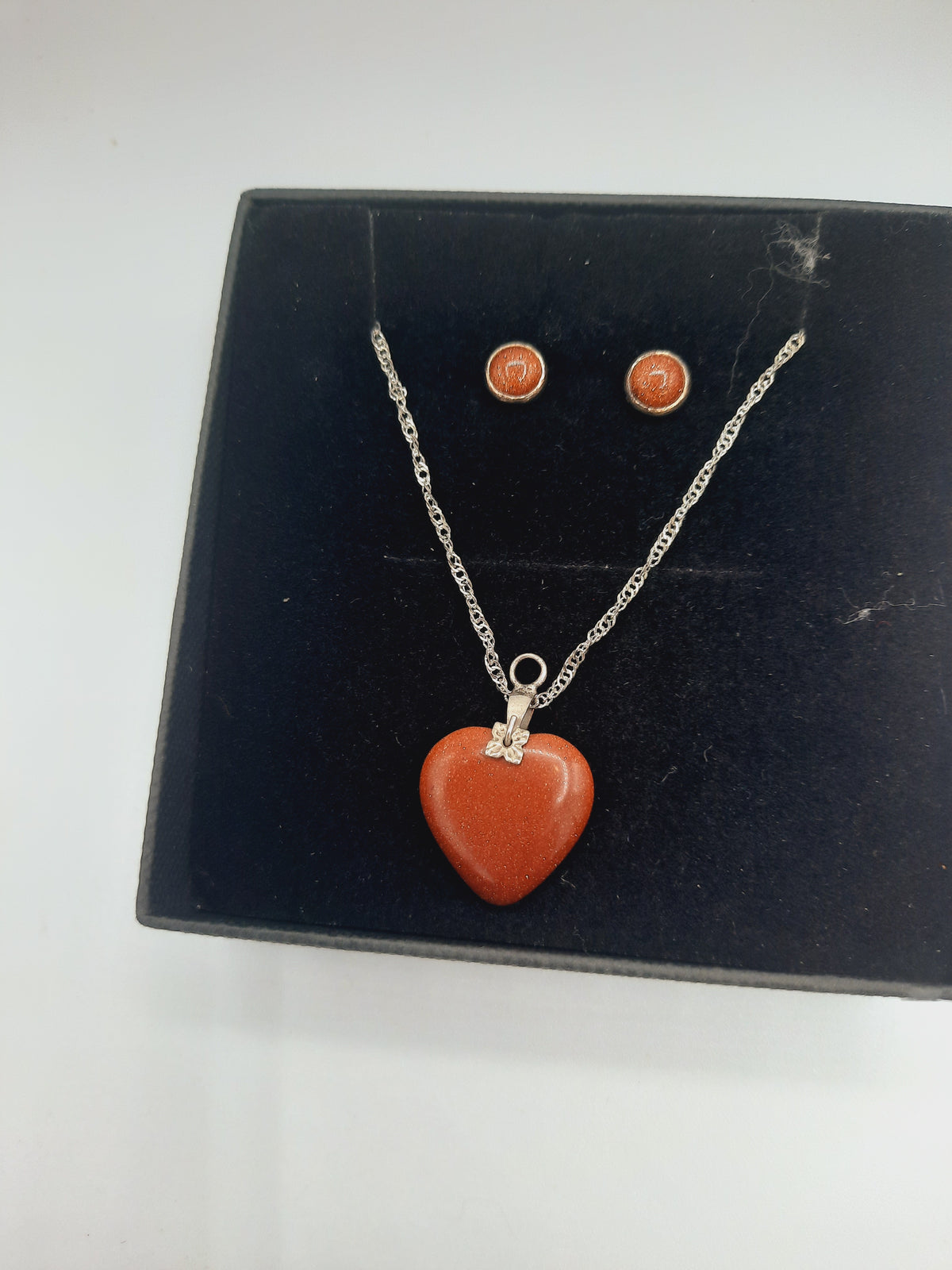 Moonstone pendant and earrings set with silver base