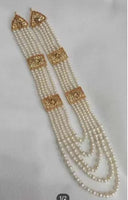 Bridal style kundan long mala with kundan jhumka and kundan teeka