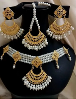 White guluband choker with earrings and teeka