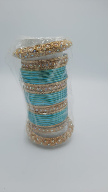 Bangles size 2.50 dia in shade of shiny aqua marine blue decorated with golden embellished kadas